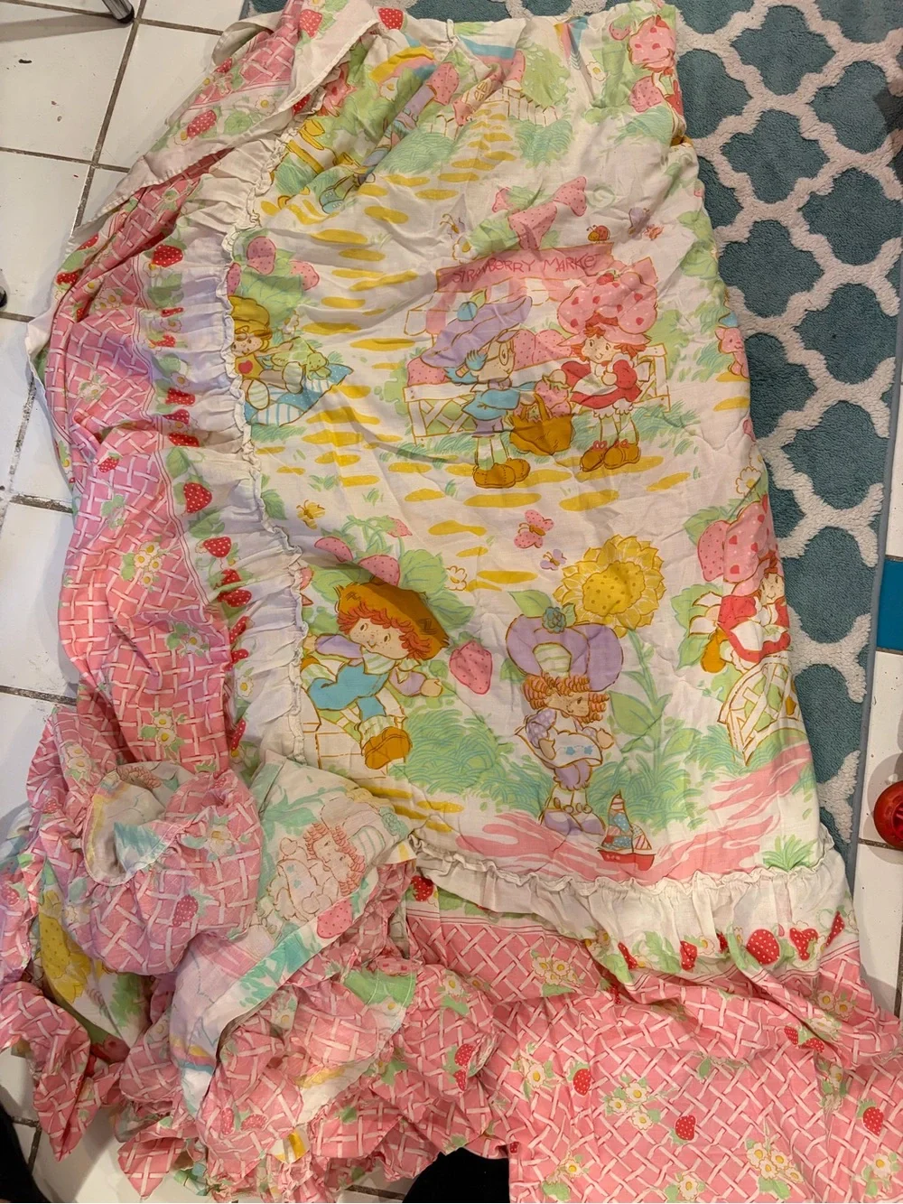 Vintage 1980 Strawberry Shortcake bedspread and pair of curtains with ties.